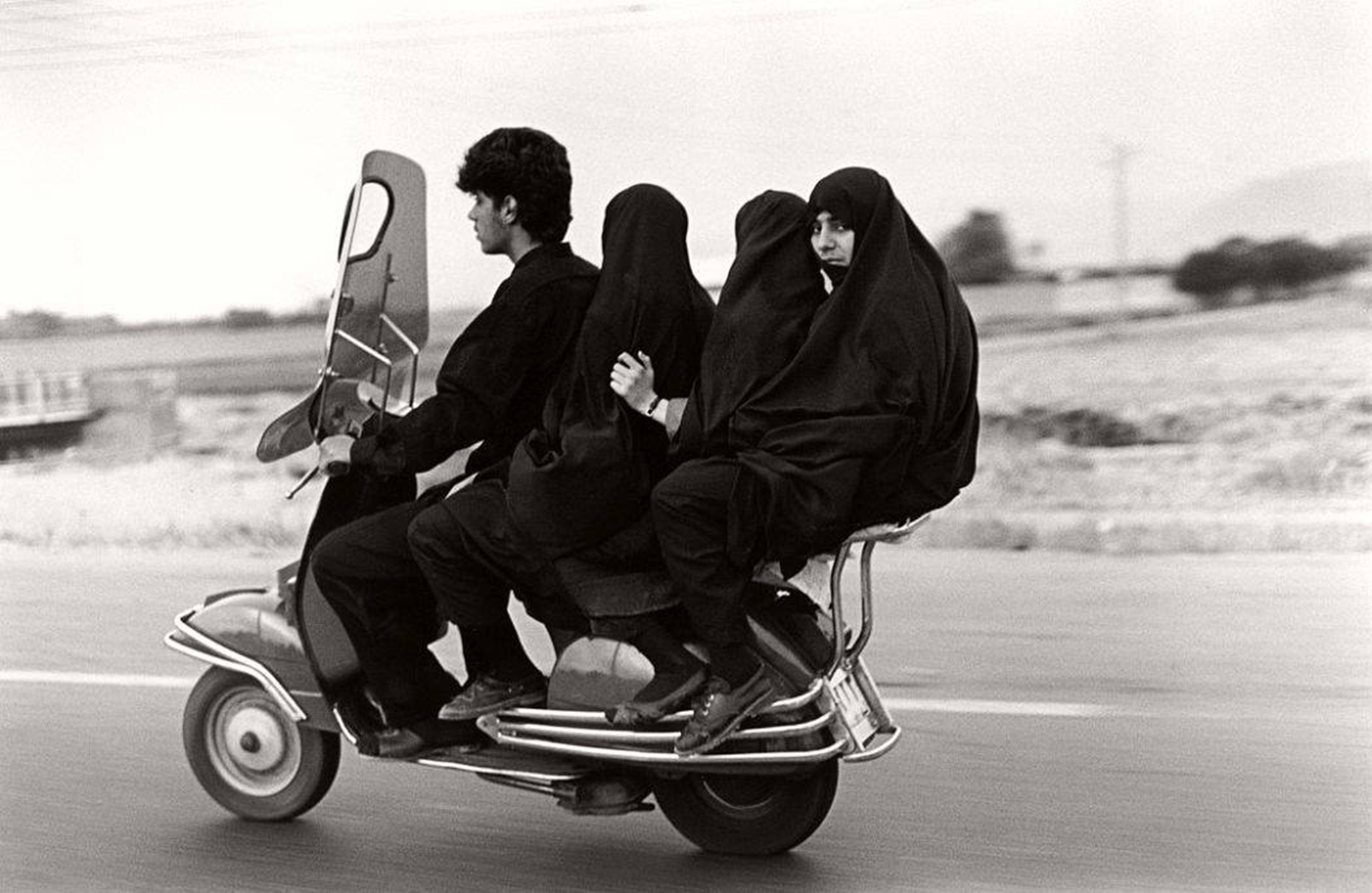 Young man, three veiled girls in a four-seater motorbike © Abbas Attar, Iran, 1997